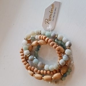 Pomina brand strench bracelet with gold turquoise and wood tones
